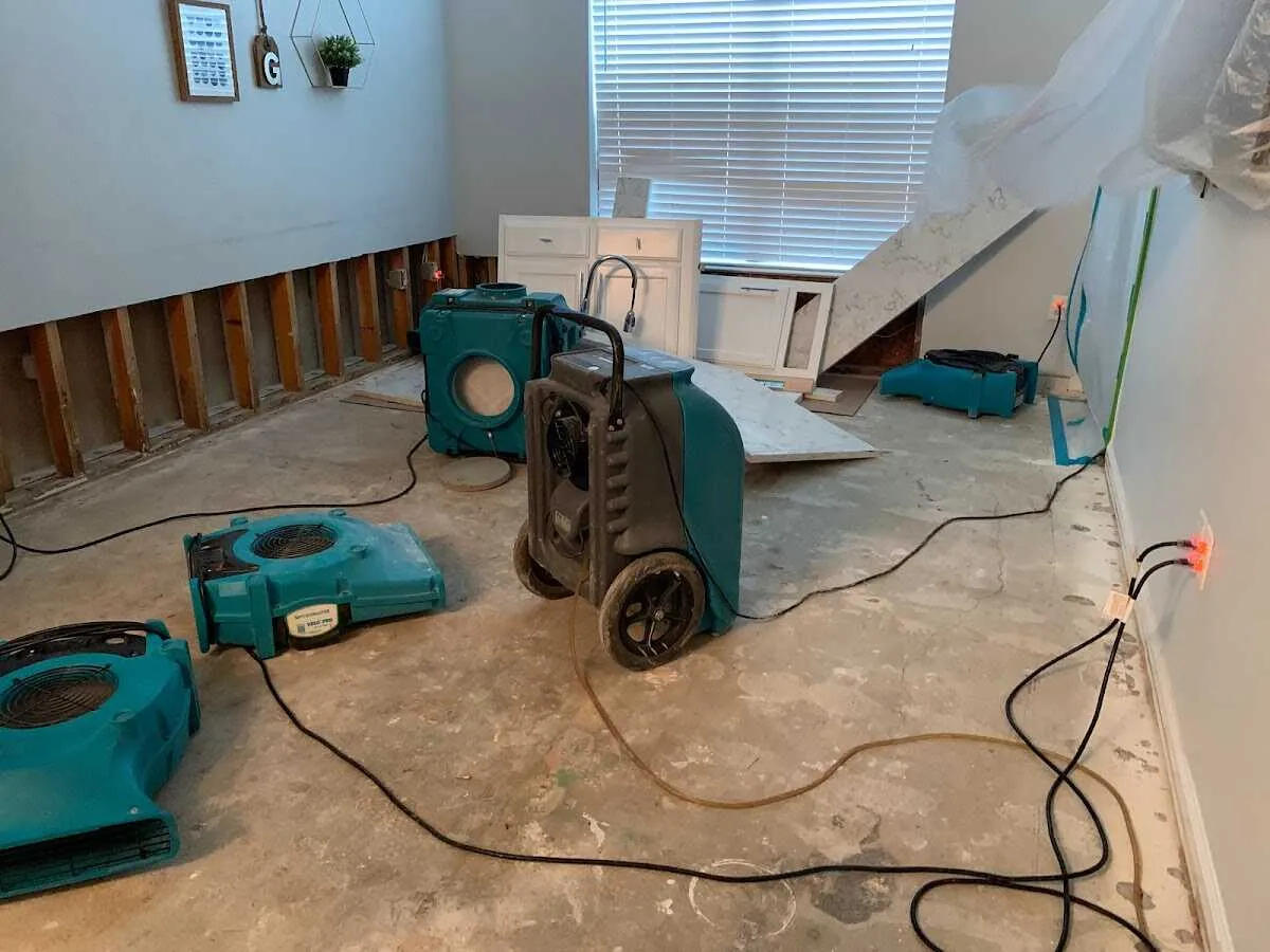 Dehumidifier in flood-cut room for Water Damage Restoration in Mounds View